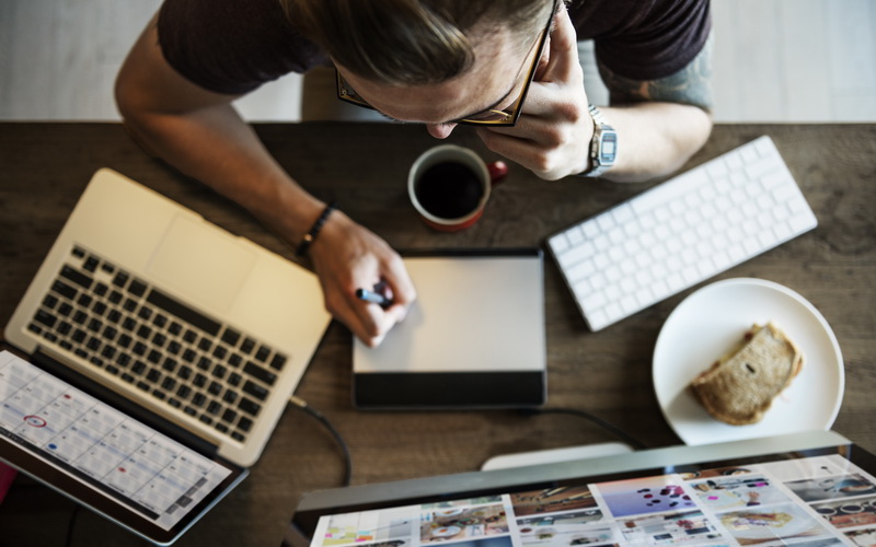 Person Working At Laptop