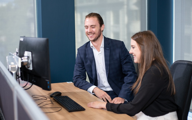 Employees Looking At A Screen